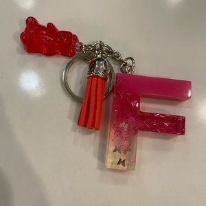 Handmade resin pink F keychain with resin gummy bear and tassel with butterflies